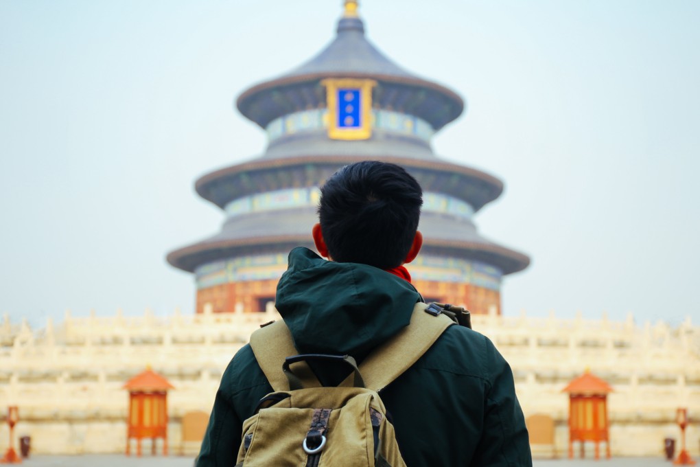 A traveller in front of the Temple of Heaven in Beijing, in China. Chinese Gen Z seeing places like this as quickly and briefly as possible thanks to “military-style travel”. Photo: Shutterstock