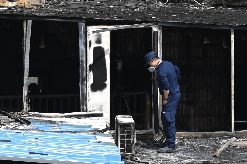 An investigator surveys fire damage at the Changfeng Hospital in Beijing, where 29 people died on Tuesday. Photo: AFP