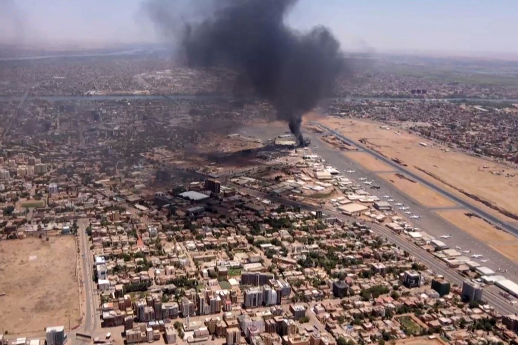 Smoke rises above Khartoum International Airport amid ongoing battles between the forces of two rival generals. Photo: AFP