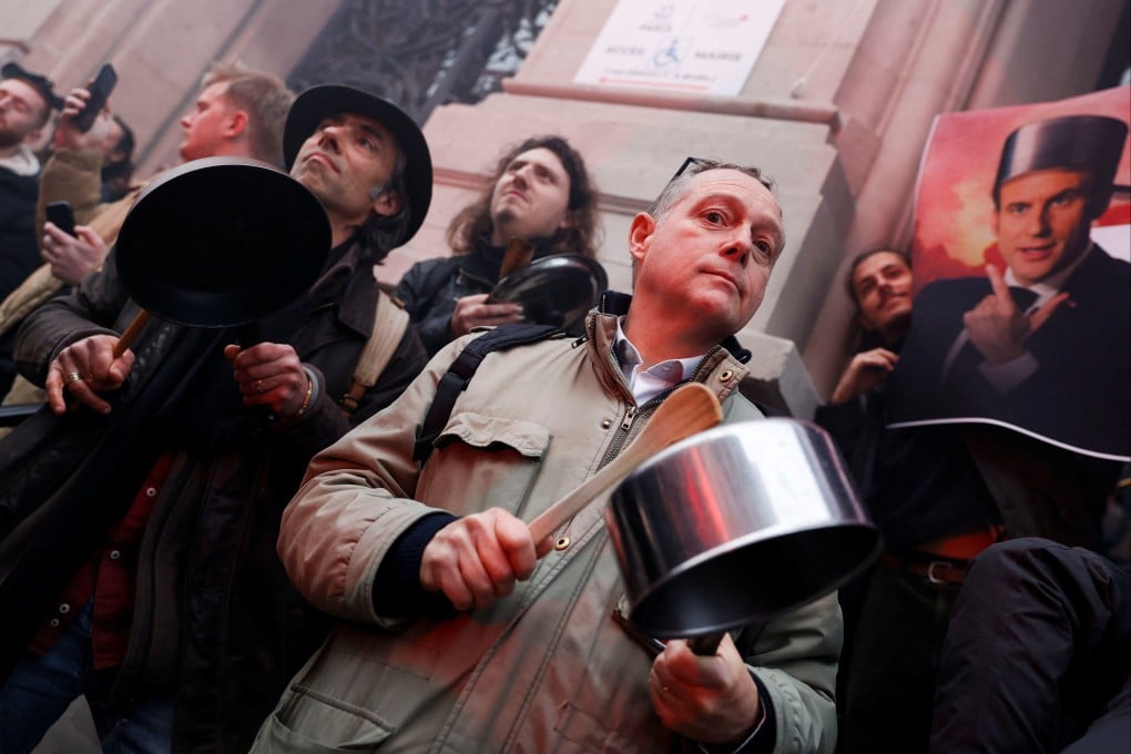 Protesters bang on a pots and pans during demonstration in Paris on Monday following a special address to the nation by French President Emmanuel Macron. Photo: Reuters