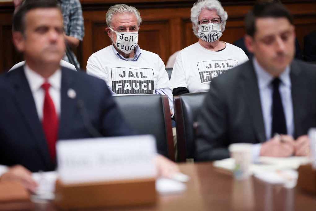 Protesters calling for the jailing of Dr Anthony Fauci listen as former director of national intelligence John Ratcliffe (left) and former deputy assistant secretary of state for East Asian and Pacific affairs David Feith testify before the House Select Subcommittee on the Coronavirus Pandemic in Washington on April 18. Photo: AFP