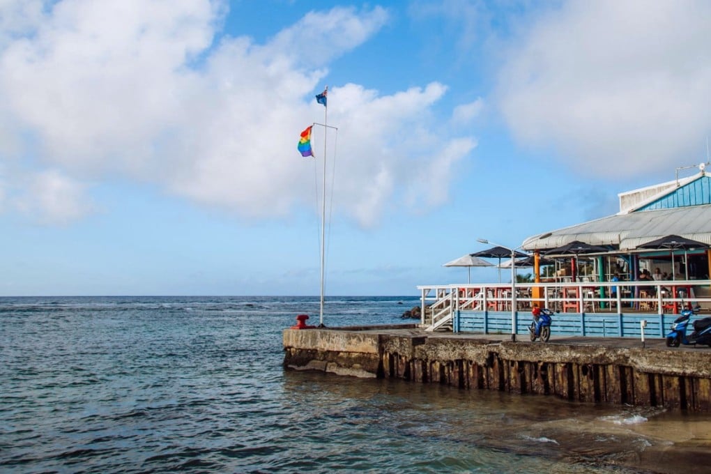 A rainbow flag flies outside a restaurant in the Cook Islands. Lawmakers in the tiny island nation of 15,000 people passed a bill on April 14 to decriminalise same-sex sexual relations. Photo: Facebook/Pride Cook Islands