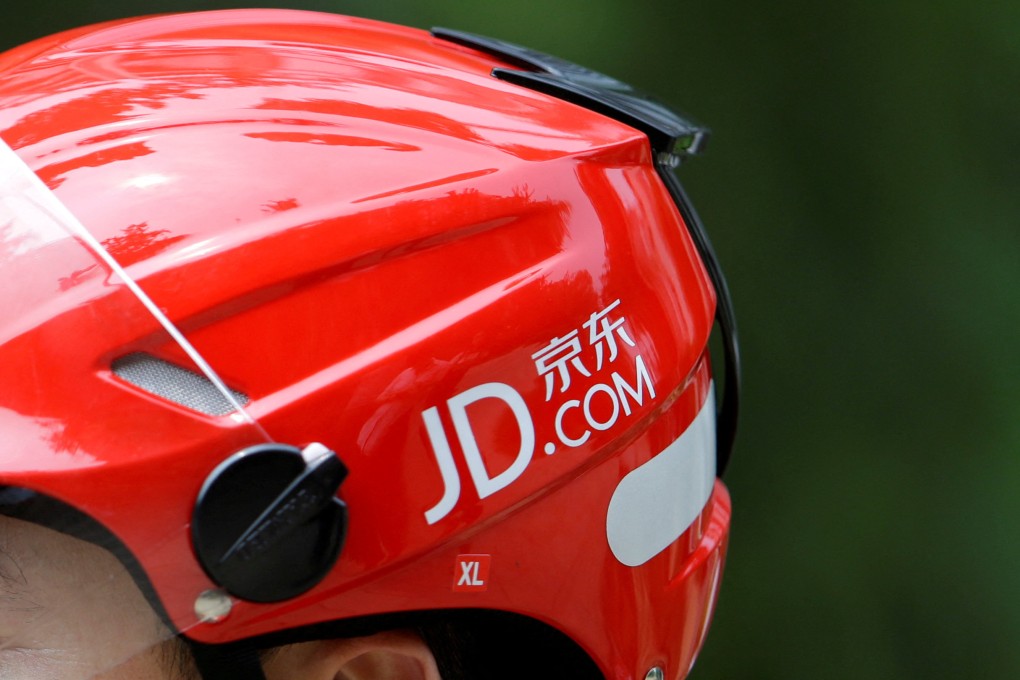 The logo of JD.com seen on a helmet of a delivery rider in Beijing on June 16, 2014. Photo: Reuters