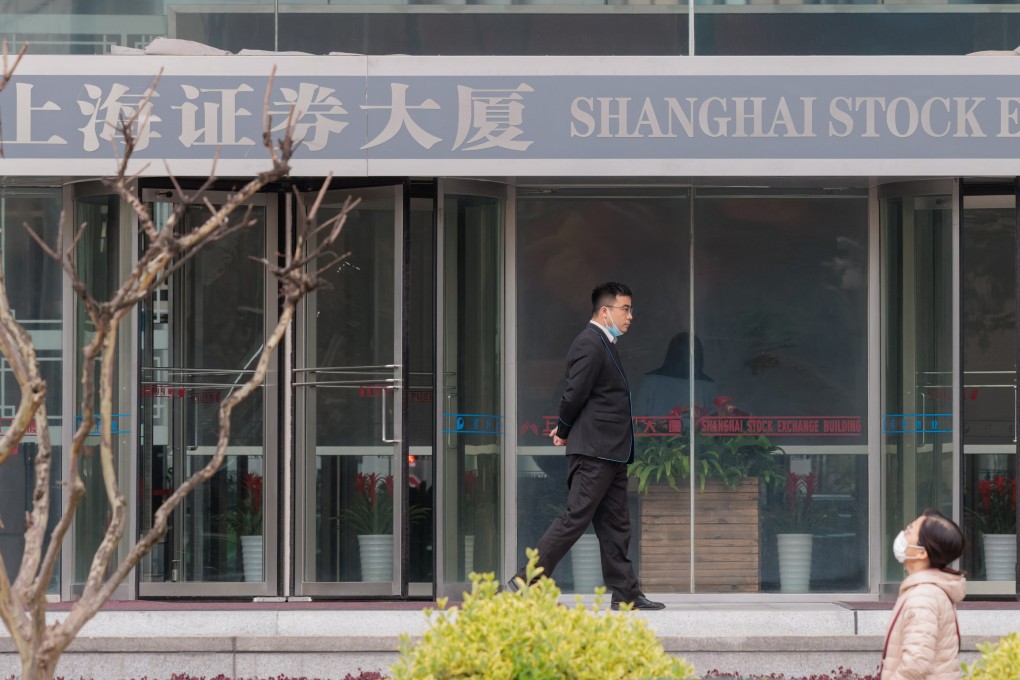 People walk in front of the Shanghai Stock Exchange Building on April 3. Photo: EPA-EFE