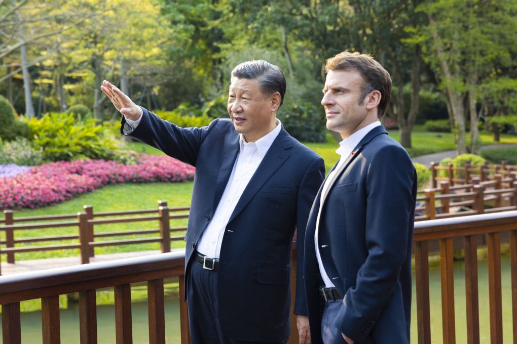 Chinese President Xi Jinping and French President Emmanuel Macron chat during a stroll through the Pine Garden in Guangzhou on April 7. Macron has alluded to to an unhealthy, even dangerous, trend in transatlantic relations. Photo: EPA-EFE/Xinhua