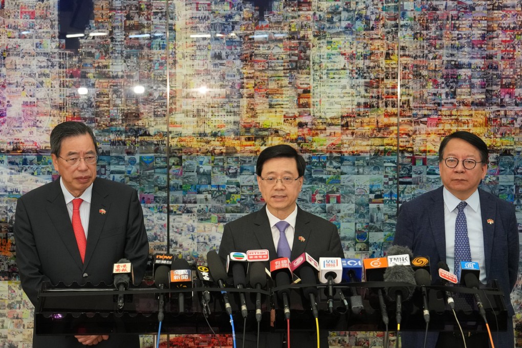 Chief Executive John Lee (centre) meets the press together with (right) Chief Secretary for Administration Chan Kwok-ki and Andrew Leung Kwan-yuen, Legco president, after arriving Hong Kong from the trip to Greater Bay Area. Photo: Elson Li