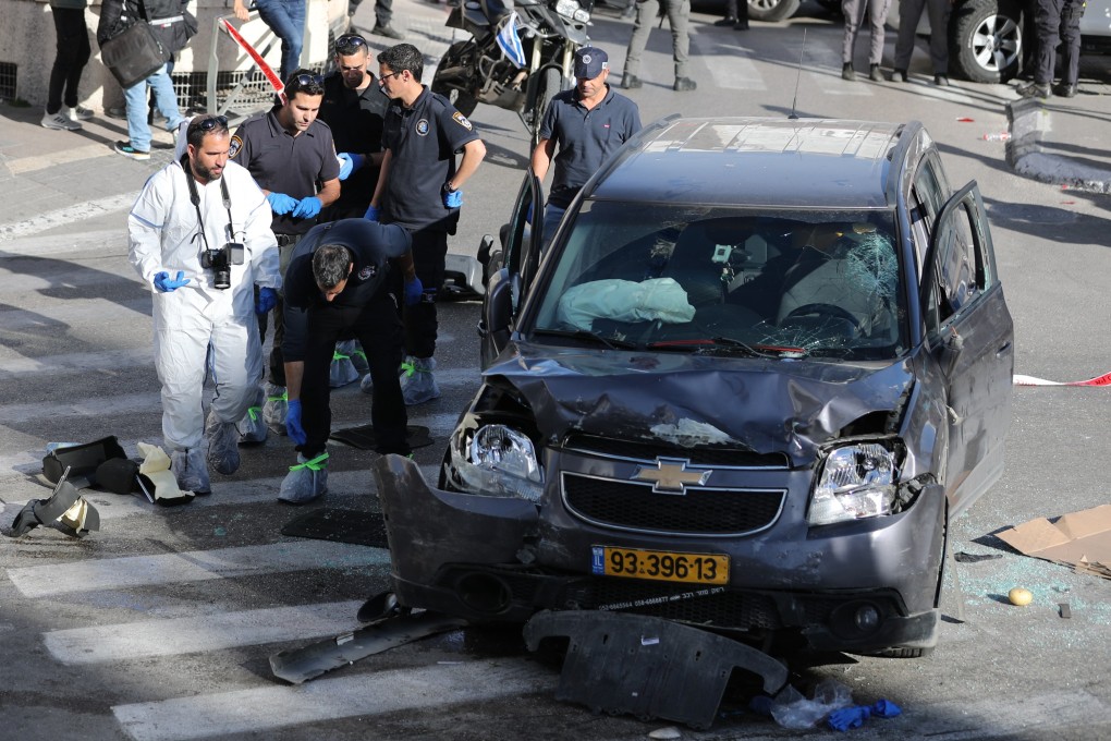 Police work at the scene where a car rammed into a crowd in Jerusalem on Friday. Photo: Xinhua