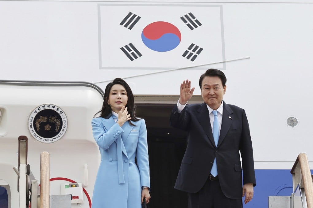 South Korean President Yoon Suk-yeol (right) waves next to his wife Kim Keon-hee before departing for the US from Seongnam Air Base in South Korea on Monday. Photo: Yonhap via AP