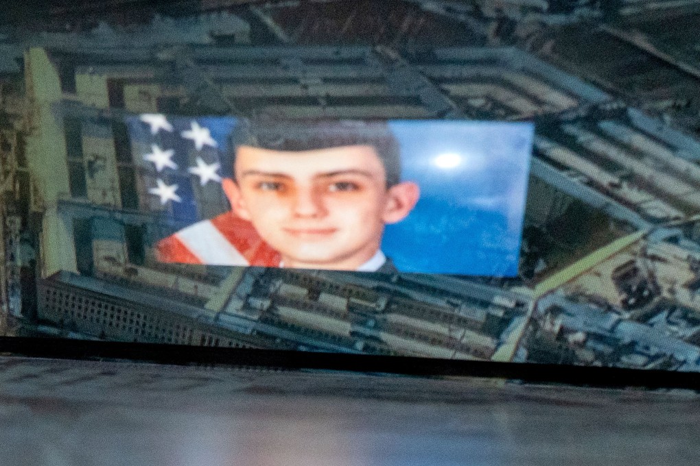 National Guardsman Jack Teixeira, reflected in an image of the Pentagon in Washington, had an “arsenal” of weapons concealed in his home. Photo: AFP