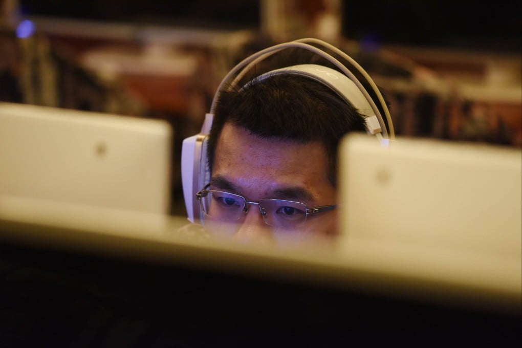 A man uses a computer in an internet cafe in Beijing, June 2017. Tianya.cn was popular before the advent of the mobile web in China. Photo: AFP