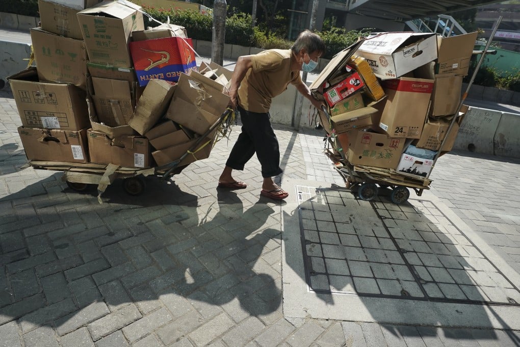 A recycler collects cardboard in the streets in Wong Tai Sin in 2020. In alleviating poverty in Hong Kong, it may be useful to identify the neediest groups, such as subdivided flat residents, single-parent families, the elderly and even women and ethnic minorities. Photo: Felix Wong