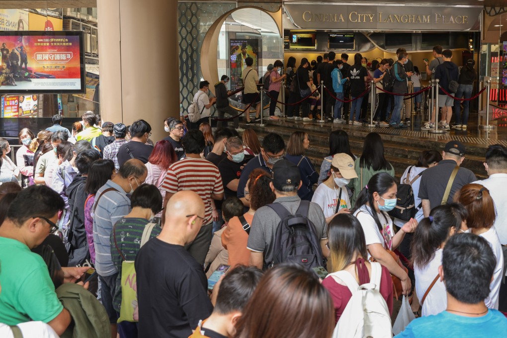 Dozens of people queue to buy movie tickets outside a cinema in Mong Kok on April 27 as online booking services struggled to cope with the high internet traffic driven by the government’s ‘Happy Hong Kong’ campaign. Photo: Yik Yeung-man