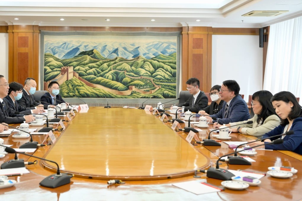 Chief Secretary Eric Chan (third right) at a meeting in Beijing as part of a working trip to the capital. Photo: Handout