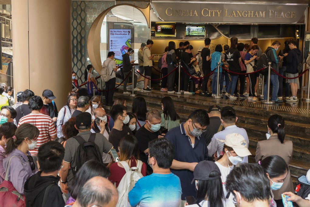 Dozens queue to buy discounted movie tickets outside a cinema in Mong Kok on Thursday. Photo: Yik Yeung-man