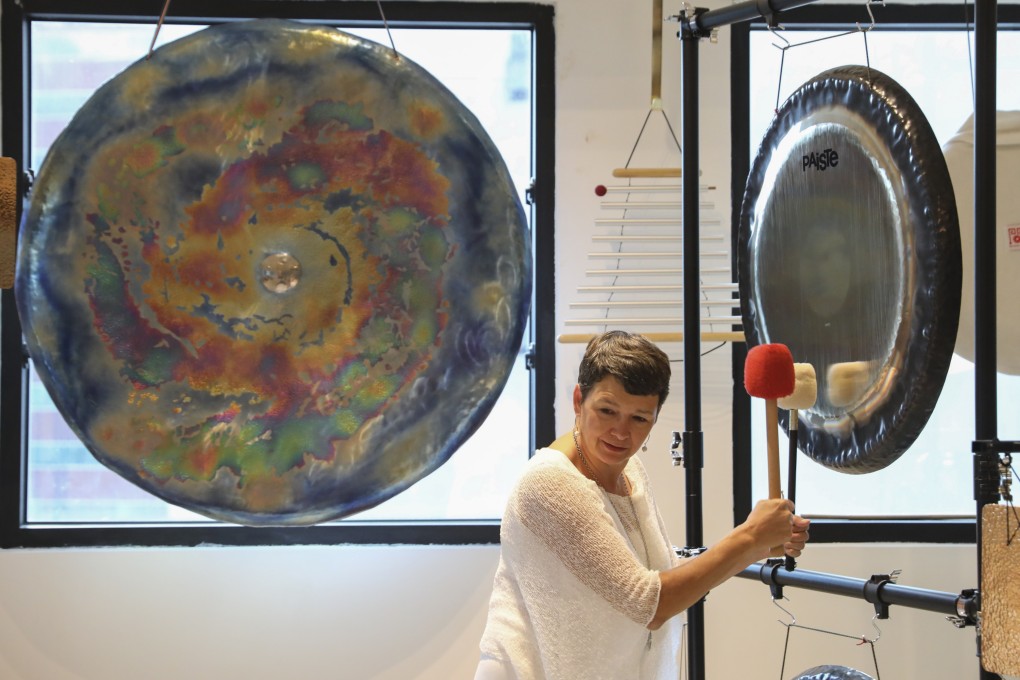 Sound bath practitioner Martha Collard uses various tools including bowls, gongs, tuning forks, aromatherapy and crystals to “rebalance” clients at Red Doors Studio in Wong Chuk Hang, Hong Kong. Photo: Nora Tam