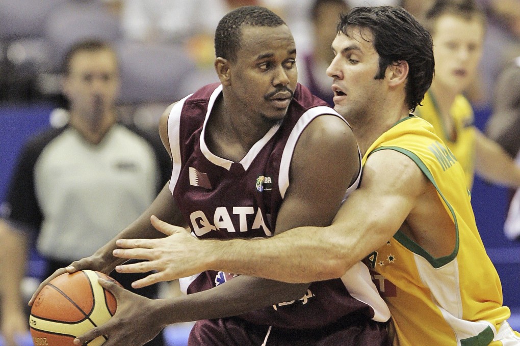 Qatar’s Hashim Zaidan (left) and Australia’s Sam Mackinnon in action during the first round Group C match at the World Basketball Championships in Hamamatsu, central Japan, in August 2006. Photo: AP