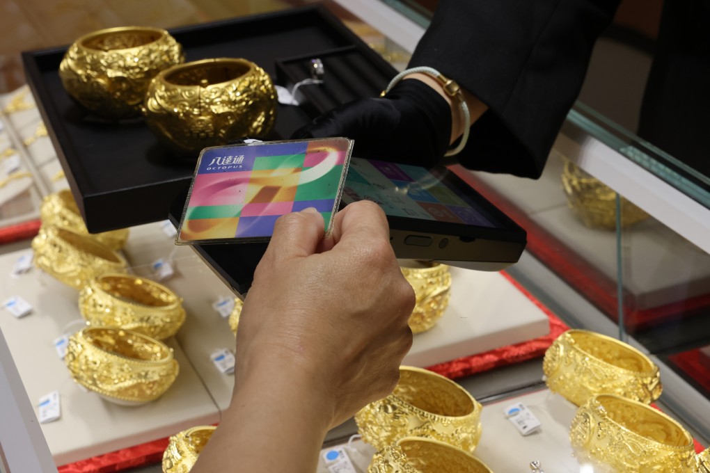 A shopper uses their consumption voucher to buy jewellery. Photo: May Tse