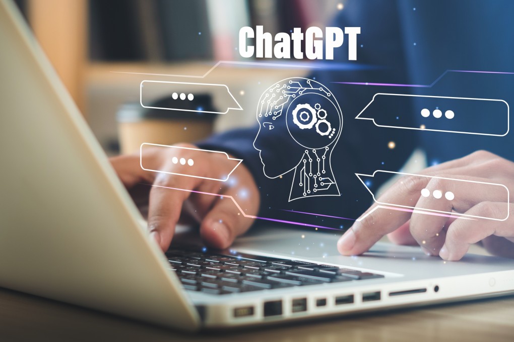 Young businessman chatting with a smart AI or artificial intelligence using an artificial intelligence chatbot developed by OpenAI. Photo: Shutterstock