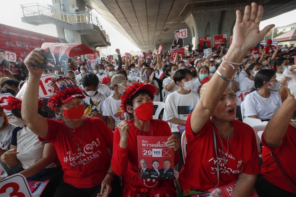 Supporters of the Pheu Thai party cheer during an election campaign rally in Bangkok. Photo: EPA-EFE