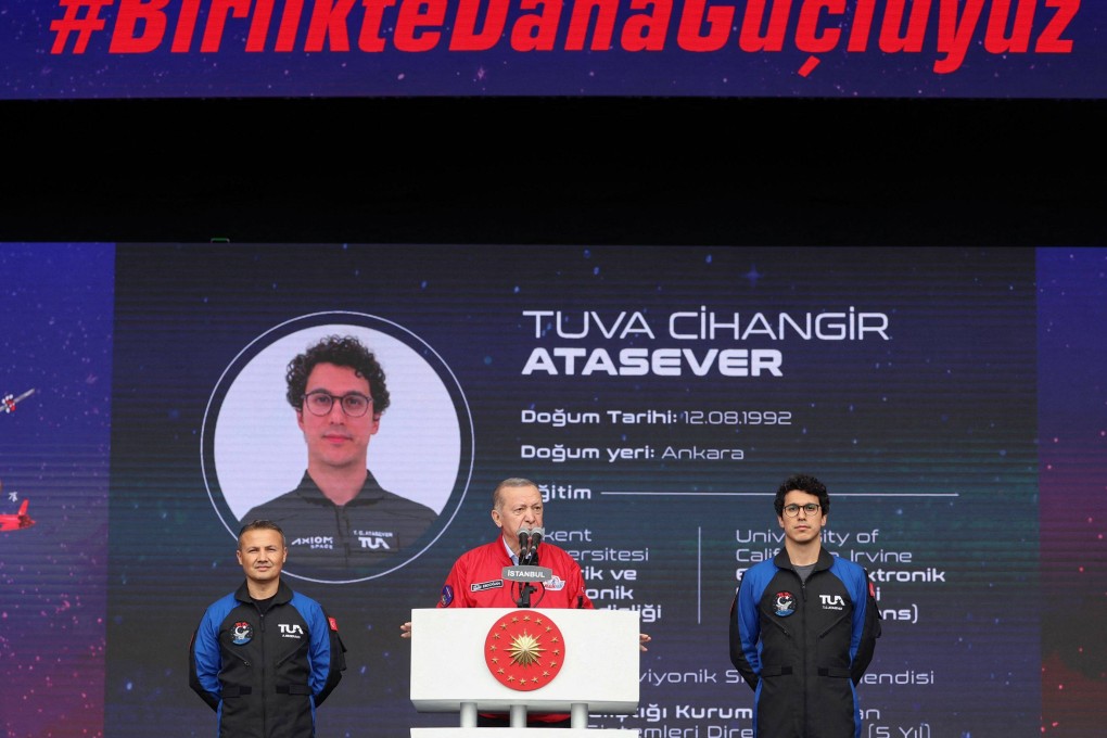 Turkish President Recep Tayyip Erdogan, centre, Turkey’s first space traveller candidates Alper Gezeravci, left, and Tuva Cihangir Atasever, at Teknofest, in Istanbul on Saturday. Photo: Handout / Press Office of the Presidency of Turkey / AFP