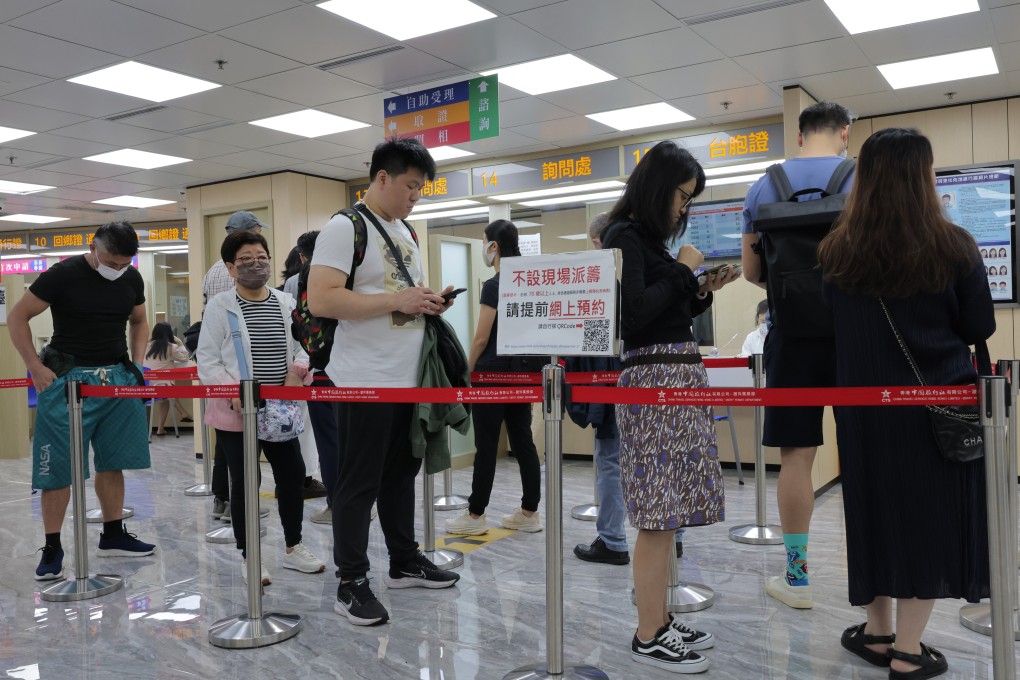 People queue for the home return permits at Hong Kong Island Service Centre of China Travel Service Hong Kong Ltd (CTS) in Sheung Wan. Photo: SCMP / Jelly Tse
