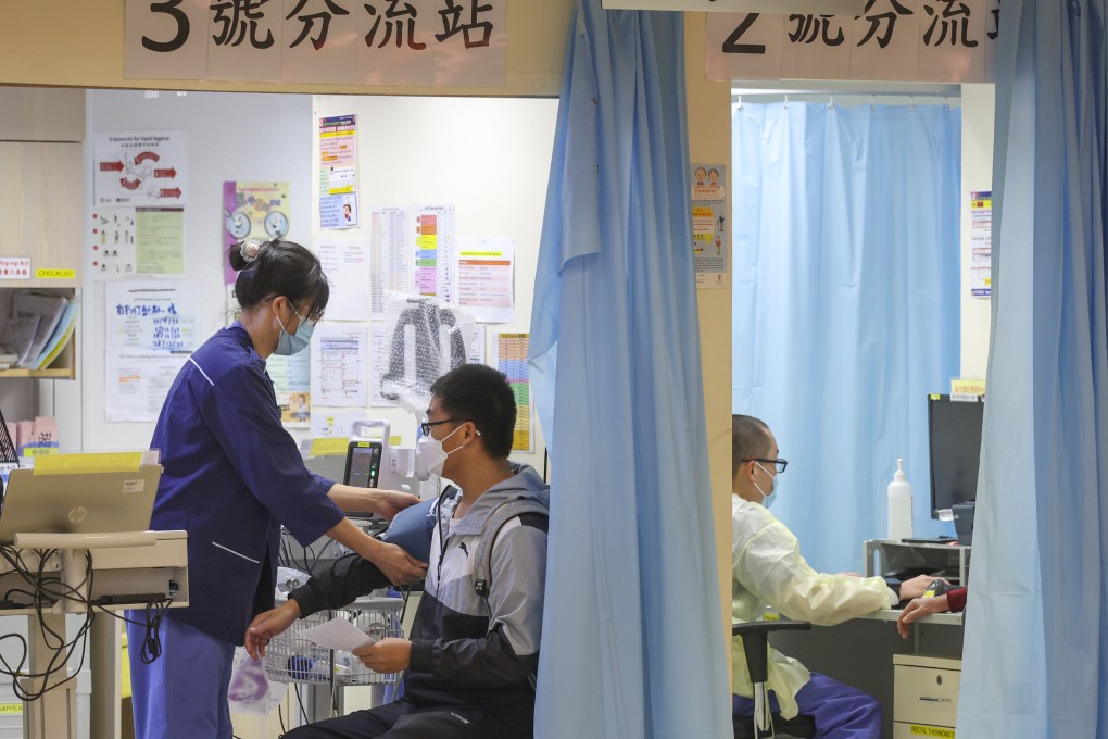 A medical worker attends to a patient at Queen Elizabeth Hospital. Photo: Yik Yeung-man