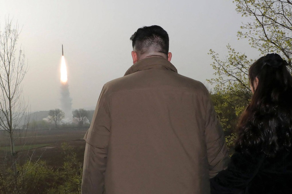North Korean leader Kim Jong-un and his daughter watch the test-firing of an intercontinental ballistic missile from an undisclosed location last month. Photo: KCNA via KNS/AFP