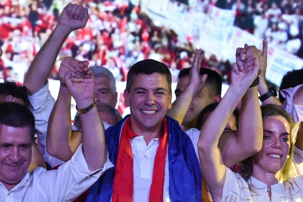 Paraguayan president-elect Santiago Pena celebrates in the capital Asuncion on Sunday after winning the poll. Photo: AFP