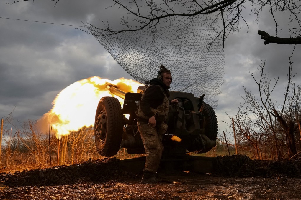Ukrainian service members fire a howitzer near the city of Bakhmut in April. Photo: Reuters