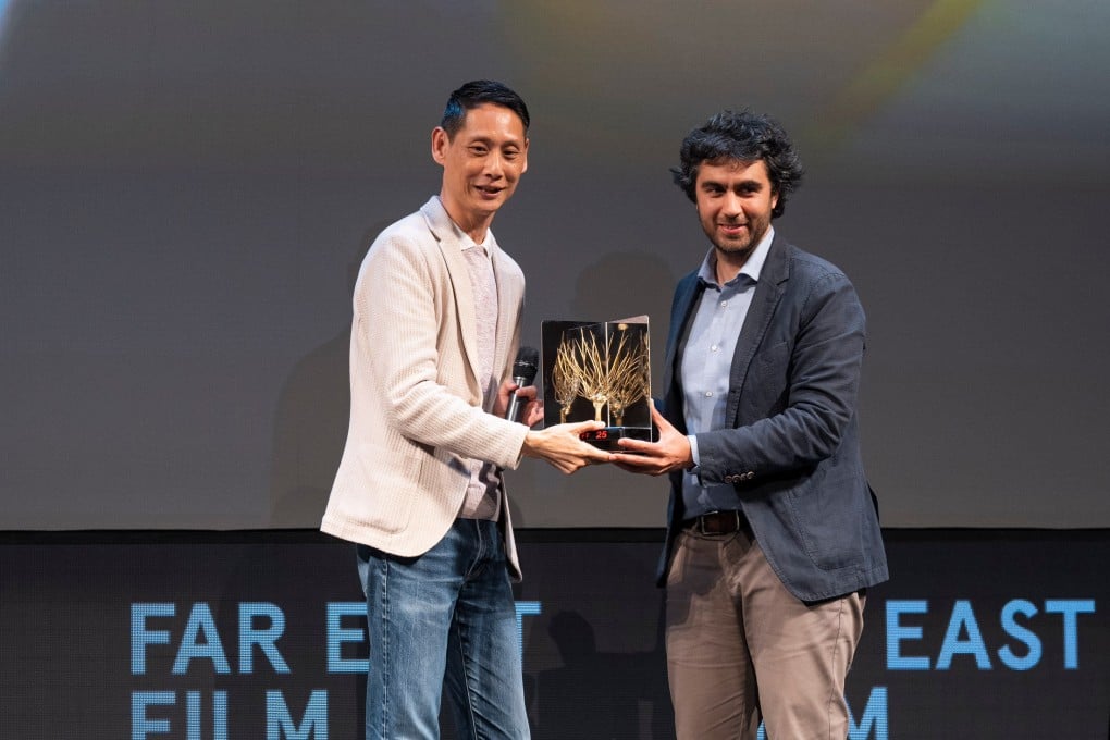 Malaysian director Jin Ong (left) receives the Golden Mulberry audience award for his film “Abang Adik” at the 2023 Far East Film Festival, in Udine, Italy. The film also won the Black Dragon Critics’ Prize for best film and the White Mulberry award for best first or second feature. Photo: Alice BL Durigatto