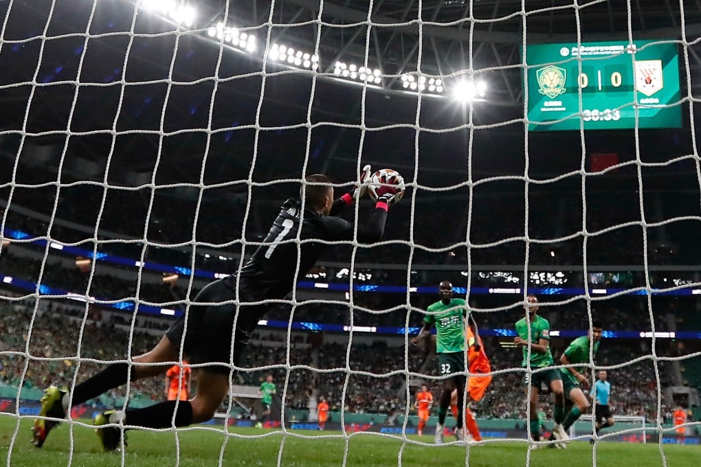 Beijing Guoan goalkeeper Han Jiaqi makes a save during Saturday’s Chinese Super League clash with Shandong Taishan. Photo: Xinhua
