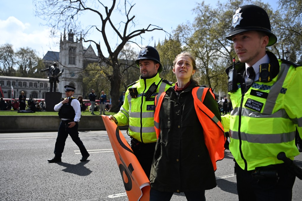 Police in London escort away a Just Stop Oil protester during a demonstration on Wednesday. There will be thousands of officers on the streets of the capital over the coronation weekend. Photo: EPA-EFE