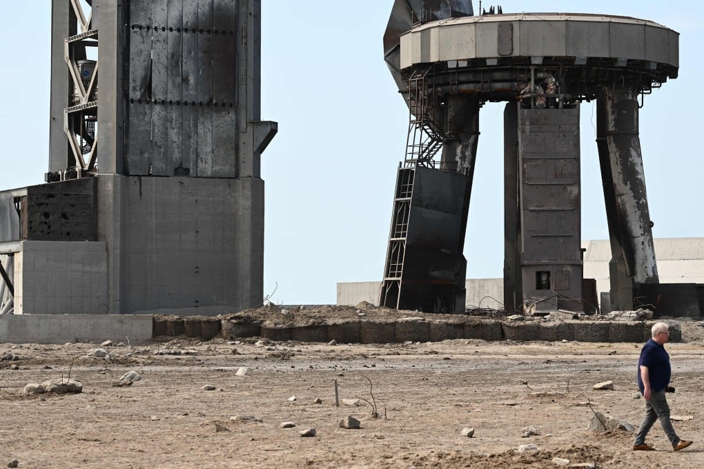A man walks through a debris field at the SpaceX launch pad on April 22 after the Starship spacecraft exploded shortly after lifting off on April 20 for a flight test from Starbase in Boca Chica, Texas. Photo: TNS
