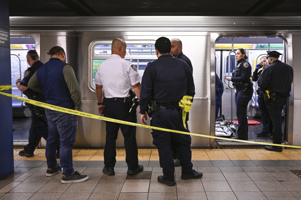 Police officers respond to the scene where a fight was reported on a subway train in New York on Monday. Photo: Paul Martinka via AP