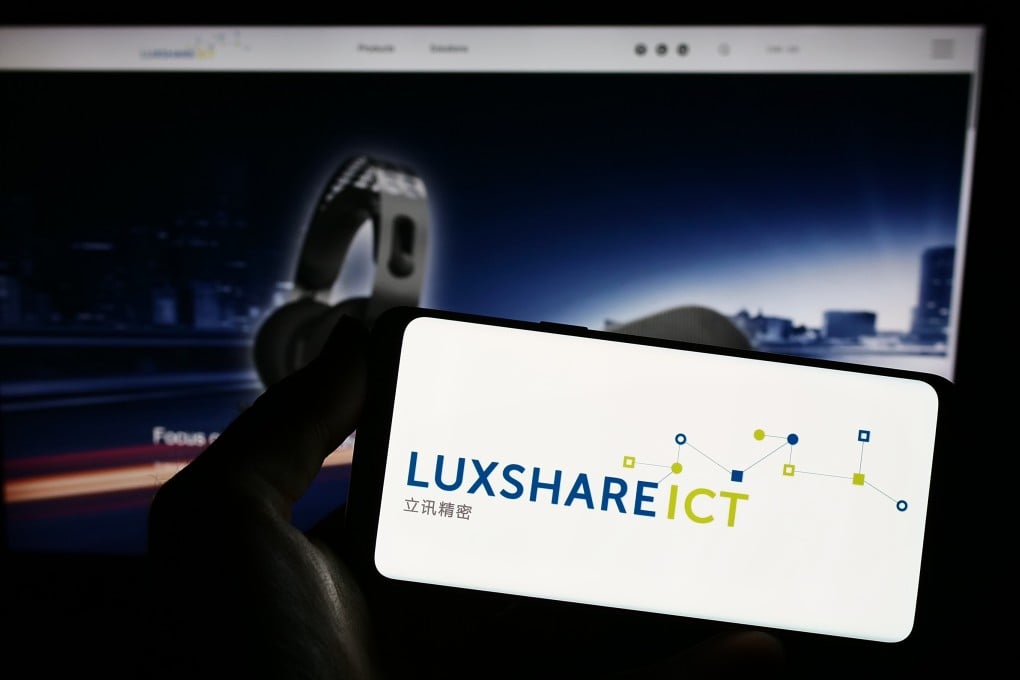 A smartphone displays the logo of Luxshare Precision Industry Co in front of the company’s website. Photo: Shutterstock