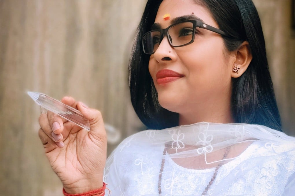 Neha Singh Ishawasya, an India-based pranic healer, uses a crystal pen and a crystal ball in her pranic facials to combat stress and make the face look younger. Photo: Neha Singh Ishawasya