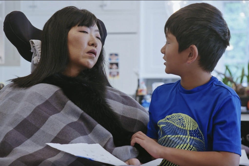 Laure Wang, former finance high-flyer struck down by locked-in syndrome, with her son Madyn in a still from “Spell Me Out”, a documentary about her released in 2022 on Amazon Prime. Madyn has no memory of his mother before she became almost totally paralysed. Photo: Amazon Prime
