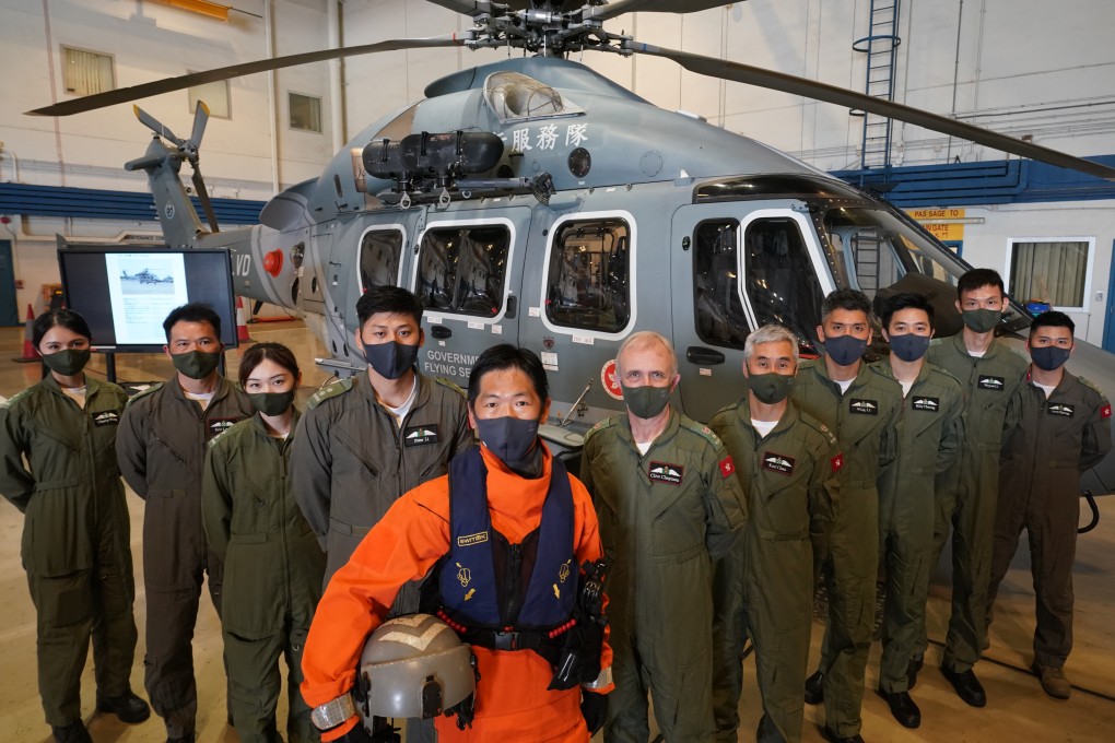 Hong Kong’s Government Flying Service (GFS) team, including Peter Li, Cyrus Szeto (in orange), Clive Chapman, Karl Chan and Billy Cheung, that rescued crew members aboard a vessel that broke in two after being pummelled by Typhoon Chaba in July 2022. Photo: Felix Wong