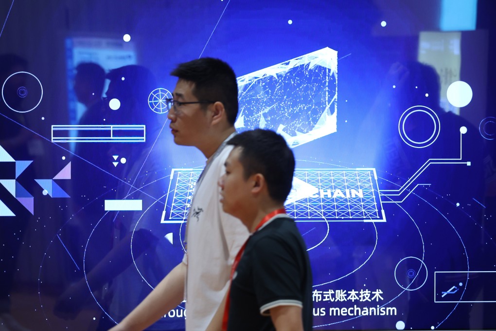 Visitors walk past a screen on blockchain at the Hong Kong Web3 Festival at the Convention and Exhibition Centre in Wan Chai on April 14. Photo: Yik Yeung-man