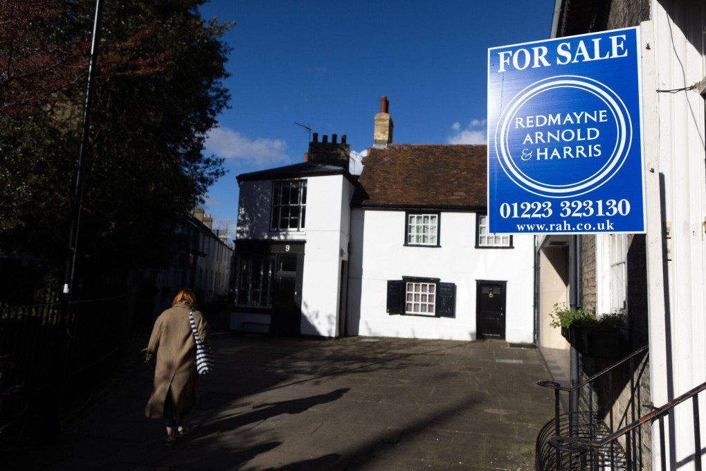 A for sale sign outside a house in Cambridge, UK. Photo: Bloomberg