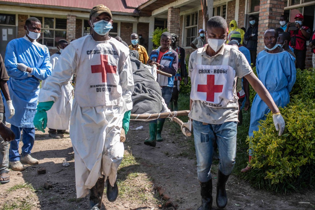 Red Cross staff carry bodies of flash flood victims in the village of Bushushu, South Kivu Province, Democratic Republic of Congo on Saturday. Photo: EPA-EFE