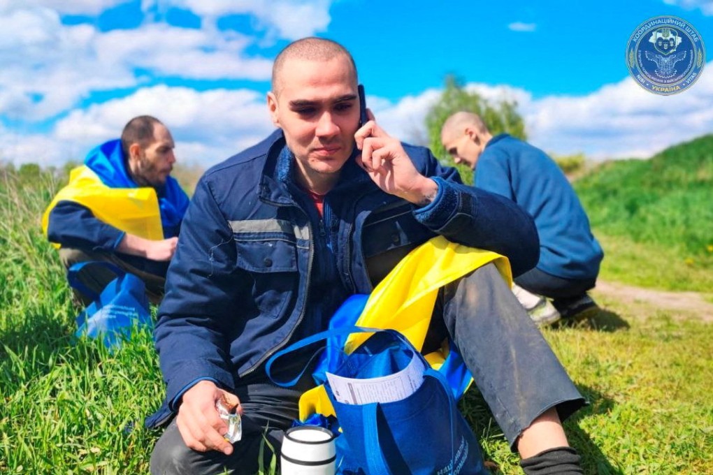 A Ukrainian prisoner of war speaks to relatives via mobile phone after a swap, amid Russia’s attack on Ukraine, at an unknown location in Ukraine on Saturday. Photo: Coordination Headquarters for the Treatment of Prisoners of War / Handout via Reuters