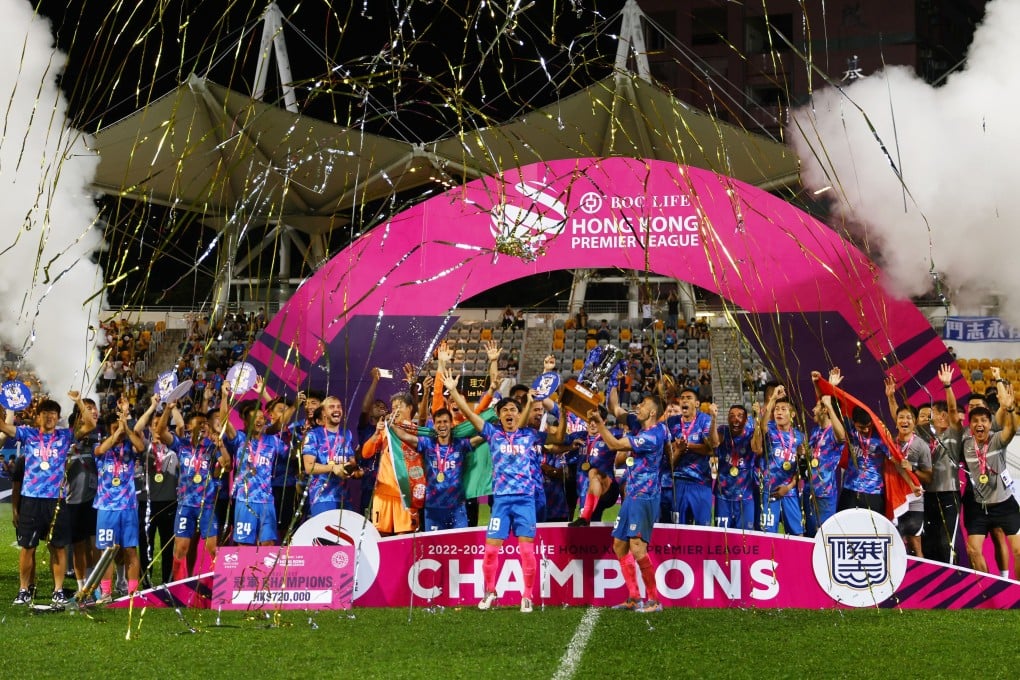 Kitchee celebrate with the Premier League trophy after earning the draw they required against Lee Man at Mong Kok Stadium. Photo: Dickson Lee