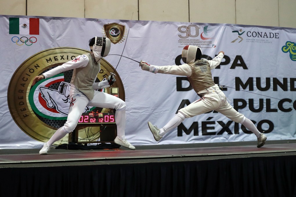 Cheung Ka-long (left) in action in the final against Mohamed Hamza of Egypt. Photo: FIE