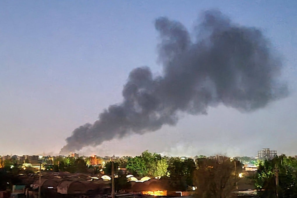Smoke billows in Sudanese capital Khartoum in fighting between forces loyal to rival generals. Photo: AFP