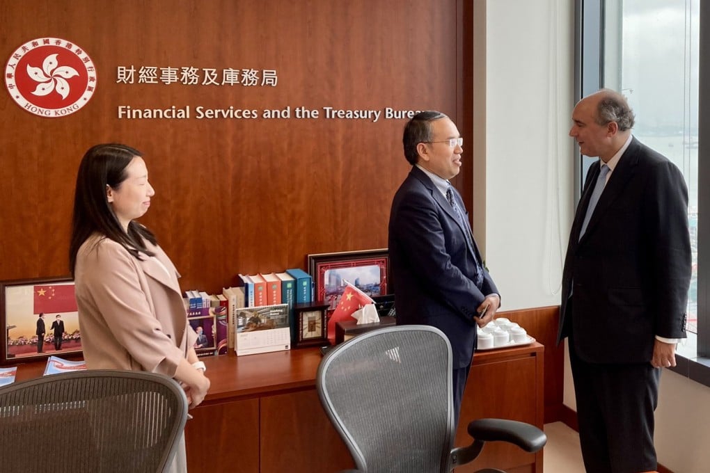 UK official Dominic Johnson (right) meets Secretary for Financial Services and the Treasury Christopher Hui. Photo: Handout