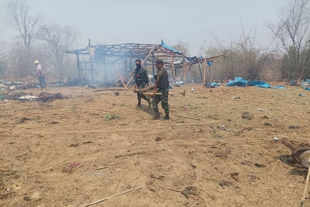 Members of Myanmar’s anti-coup ‘People’s Defence Forces’ carry the body of a victim of an airstrike by the military junta on a village in the Sagaing region in April. Over 100 people are believed to have been killed. Photo: EPA-EFE