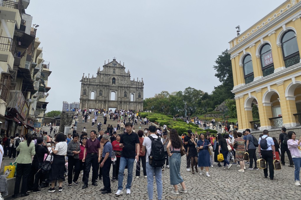 Tourists visit the ruins of Saint Paul’s in Macau on May 2 during the week-long Labour Day holiday earlier this month. Photo: Li Jiaxing