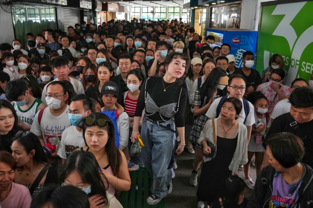 Tourists queue to take the ferry from the Tsim Sha Tsui pier on May 1. Photo: Elson Li
