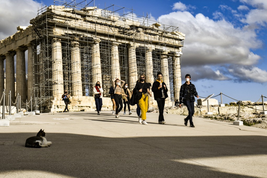 Visitors near the Parthenon temple in Athens, Greece. Photo: Getty Images